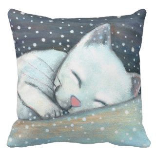 sleeping cat and snow pillows