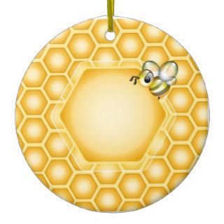 Honeycomb background with a cute honeybee christmas ornament