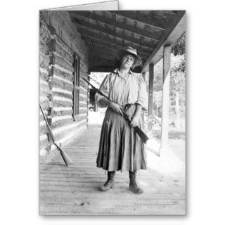 Woman holding a rifle on a porch cards