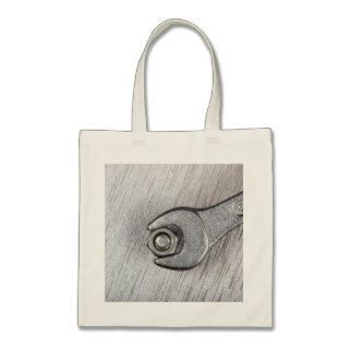 Wrench, bolt and nut on metal surface tote bag