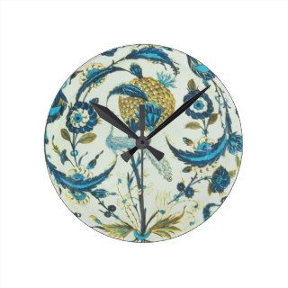 Iznik dish painted with a peacock perched among fl wall clocks