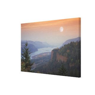 The moon hangs in the sky above the Vista Gallery Wrap Canvas