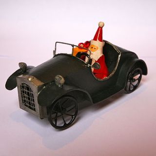 santa driving black car decoration by london garden trading