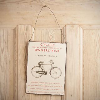 vintage style metal bicycle or car sign by the contemporary home