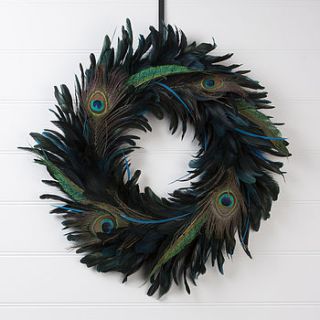 ornate peacock feather wreath by the contemporary home