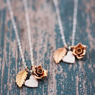 delicate gold and silver mixed charm necklace by j&s jewellery