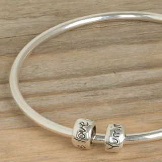 silver bangle with two engraved mojo beads by scarlett jewellery