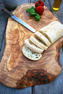 large rustic wooden serving board by the rustic dish