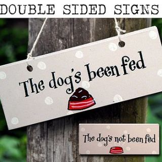 wooden sign 'the dog's been fed' by angelic hen