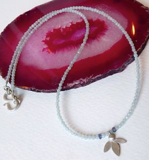 ami leaf on aquamarine necklace by blossoming branch
