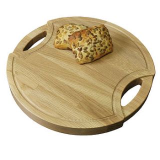 round solid wood chopping board with handles by stuart clarkson design