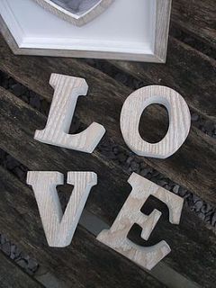 natural wooden 'love' letters by the hiding place