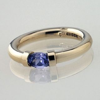 tension set gold ring with tanzanite by anthony blakeney