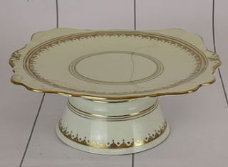 cream and gold vintage pedestal cake stand by the vintage tea cup