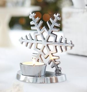 christmas tree or snowflake tea light by the contemporary home