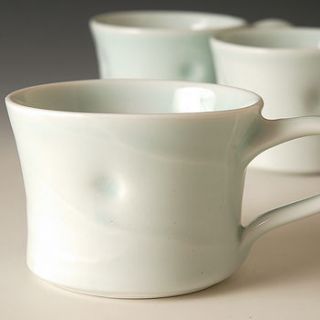hand thrown, delicate porcelain mugs by joanna howells