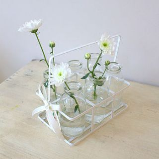 set of six milk bottles in a crate by ella james