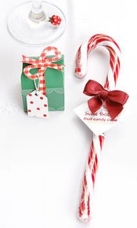candy cane with bow by red berry apple