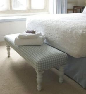 long gingham footstool by legs on