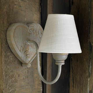 carved wooden heart wall light with ivory shade by dibor