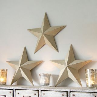 wooden hanging star by red lilly