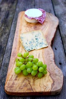 large rustic wooden presentation plank by the rustic dish