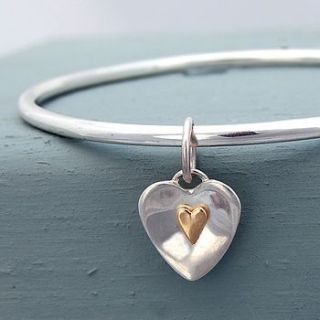 handmade flutter silver and gold heart bangle by alison moore silver designs