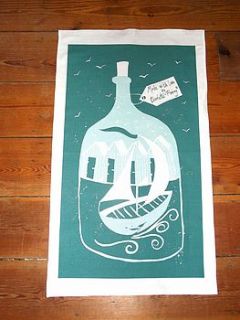 boat and beach huts in a bottle tea towel by charlotte fleming