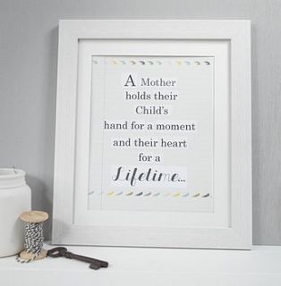 'a mother' wording framed print by tilliemint loves