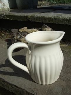 cream ceramic milk jug by the hiding place