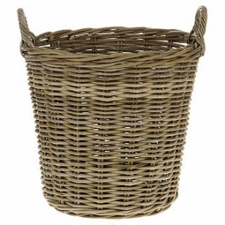 rattan log basket by the contemporary home