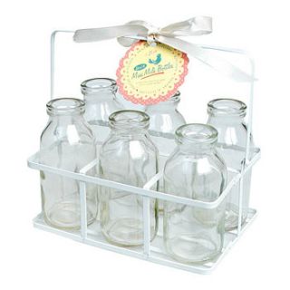 set of six school milk bottles in crate by the orchard