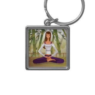 Woman sitting in lotus position, meditating key chains