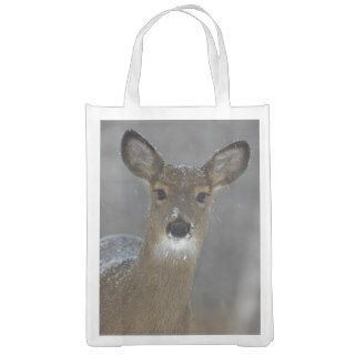 Female white tailed deer in snow shower grocery bag