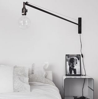 swing arm wall light by bodie and fou