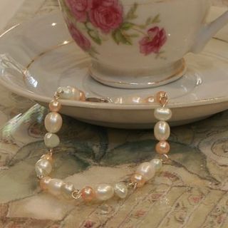 sterling silver and freshwater pearls bracelet by candle and blue