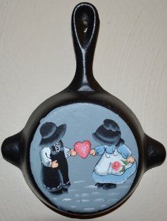 Black Iron Metal Skillet Wall Hanger Ashtray Miniture Decoration 4 7/8 X 6 1/4 X 7/8 Inch Bottom Painted Amish Boy and Girl Holding a Pink Heart Between Them Showing Love  Other Products  