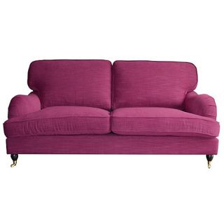 Large fuchsia pink Alethea sofa with castors