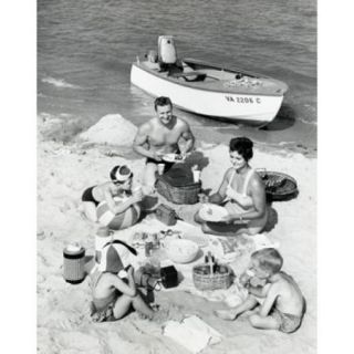 Parents with three children having picnic on beach Poster Print (18 x 24)